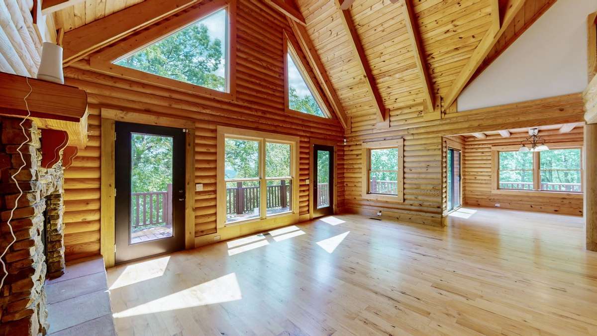 Livingroom flows seamlessly from interior to exterior.  Enjoy meals on the large back deck over looking nature.