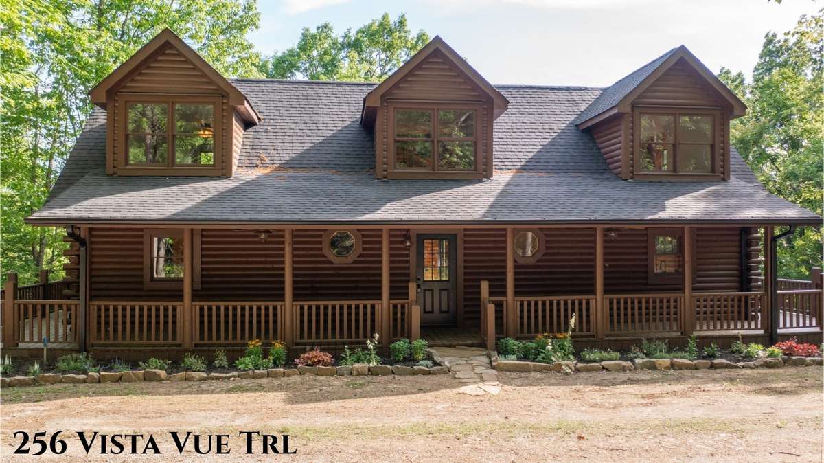 Welcome to the front porch of 256 Vista Vue Trl!!  It's ready for your rocking chairs as you sip coffee in the morning and watch the wild life go by.