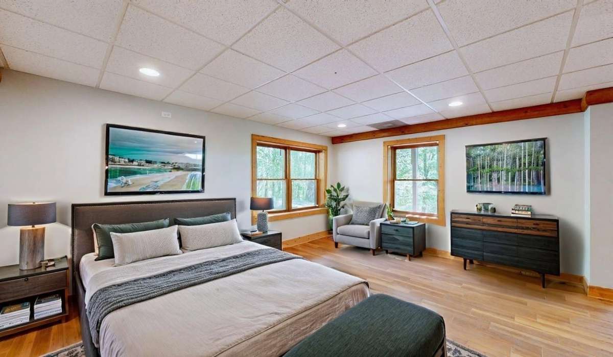 Virtually staged basement area shows the flexibility of the space.  Additional sleep areas or game room?  Perhaps a hobby room or home gym?