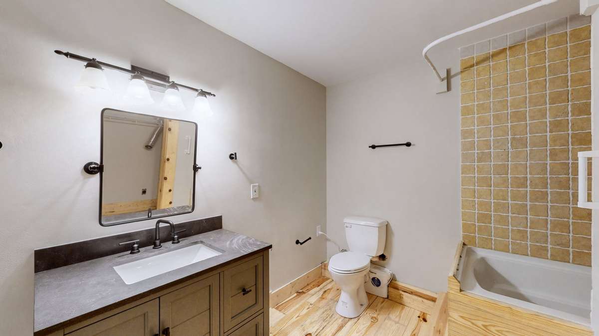 The basement offers a full bath and laundry combo.