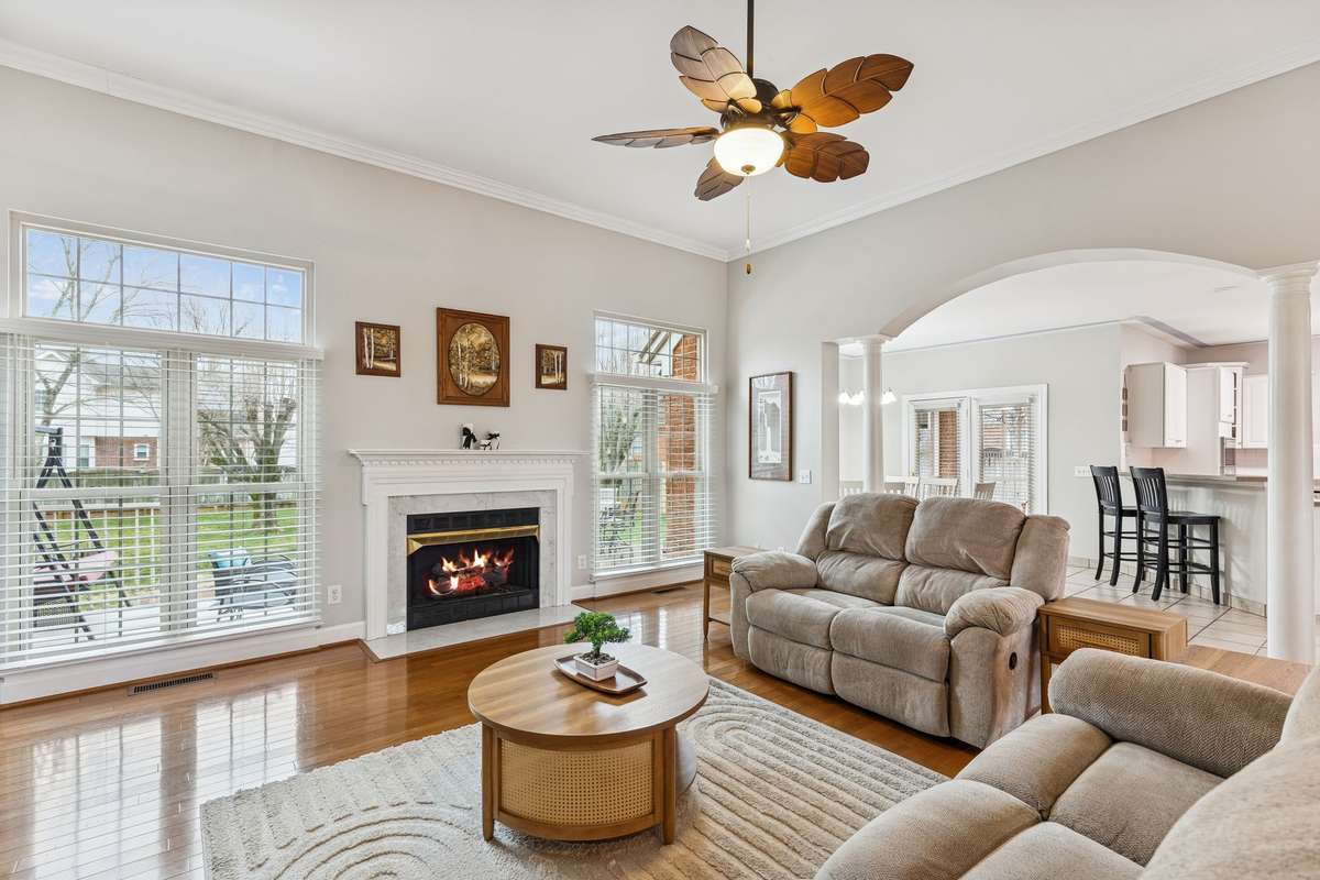 Oversized windows frame the fireplace and flood the space with natural light, while the open flow into the kitchen makes it ideal for both entertaining and everyday living! 2409 Amber Glen Court, Murfreesboro, TN 37128