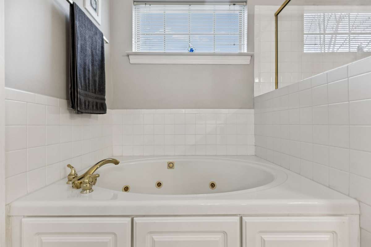 Soak away the stresses of the day in your own garden tub with tiled surround!  2409 Amber Glen Court, Murfreesboro, TN 37128