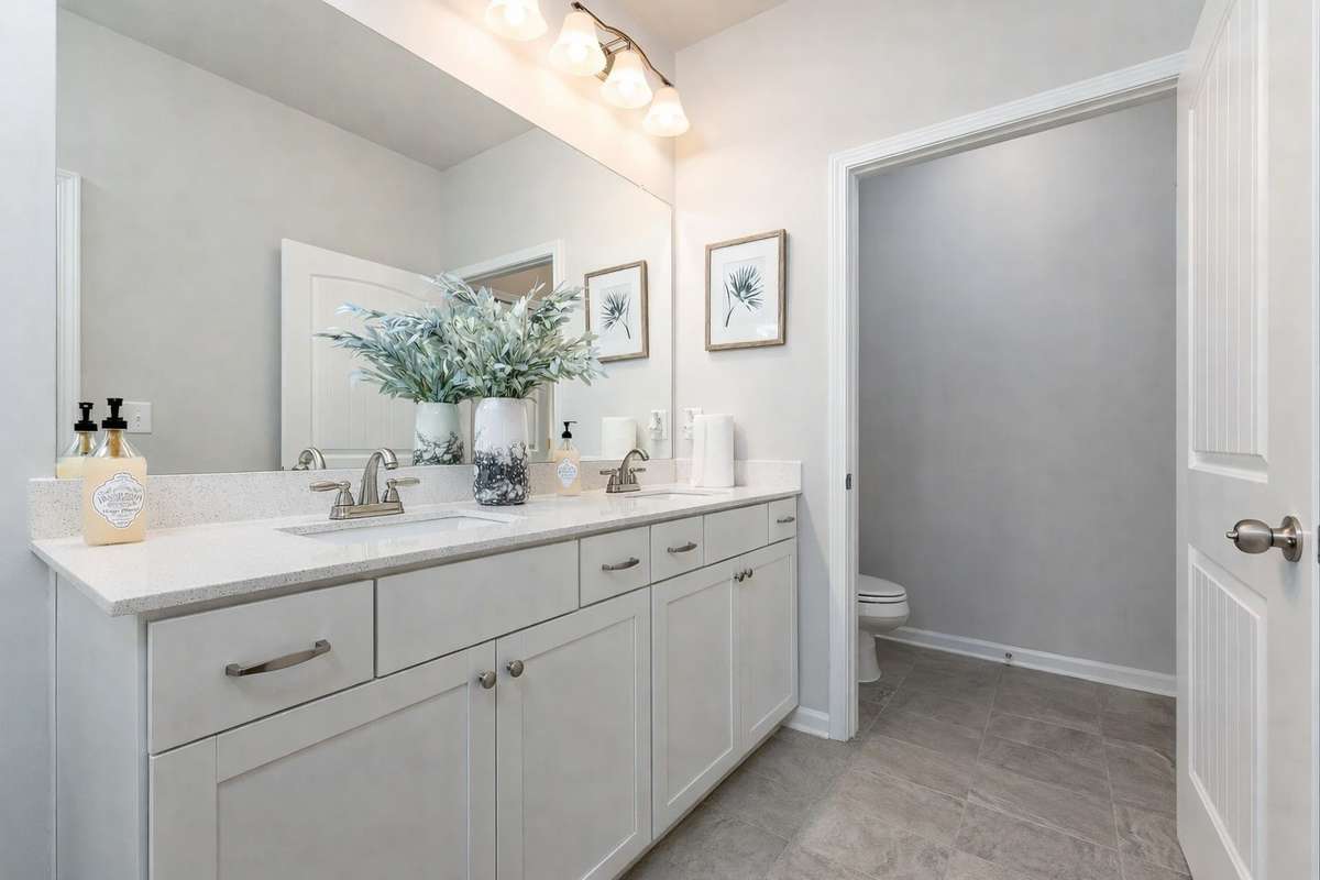 Model home photo, cabinet color may be different than listed home.