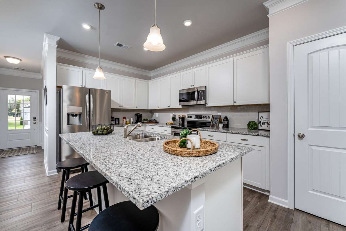 These are pictures of the model home with same layout, cabinet color may vary.
