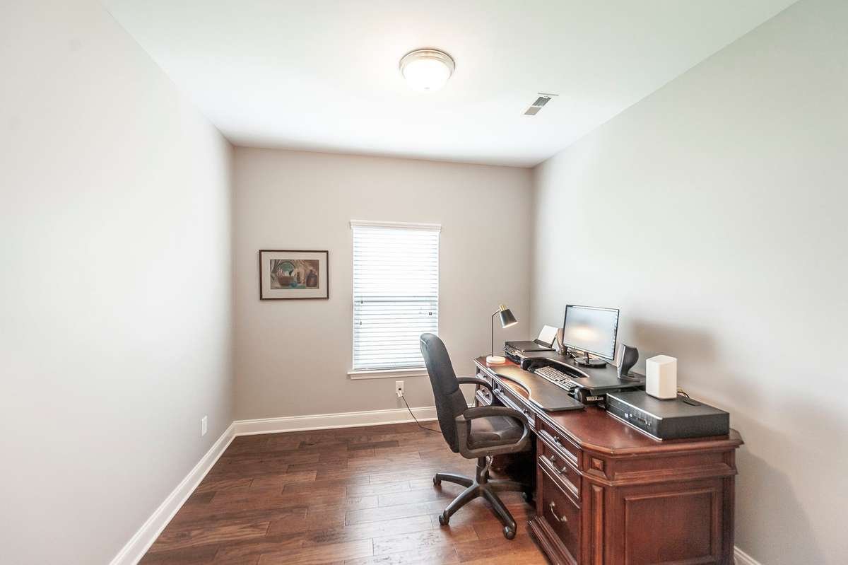 Main level Home Office with french doors for added privacy
