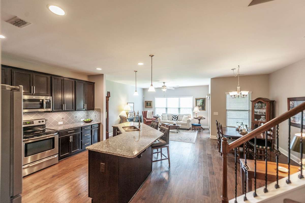 Deluxe kitchen with a huge island makes this open concept ideal for everyday living and entertaining