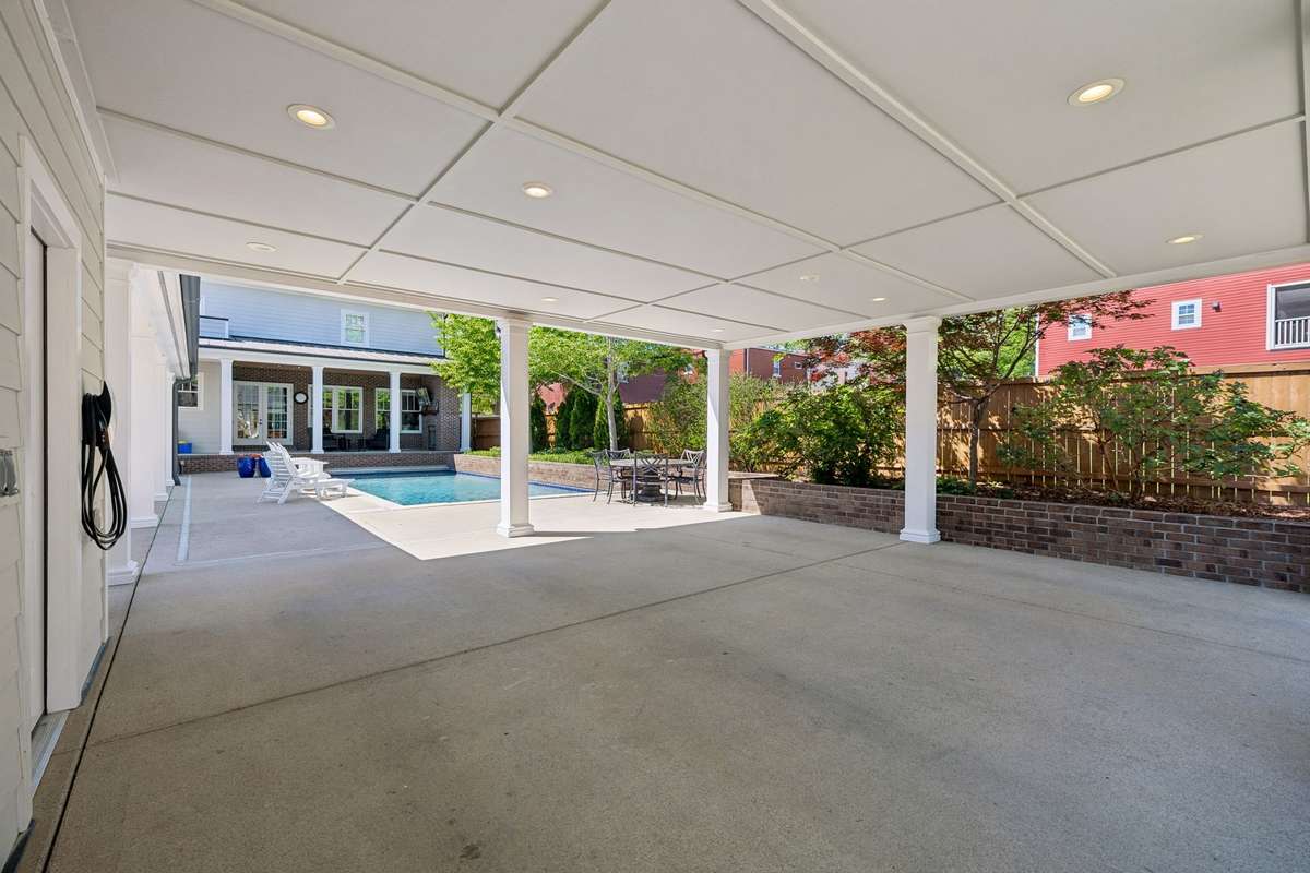 More than just a carport, this architectural pavilion features lighting, high clearances and lovely views. The gracious, open-concept design transitions effortlessly from a refined shelter to an coveted outdoor social space.