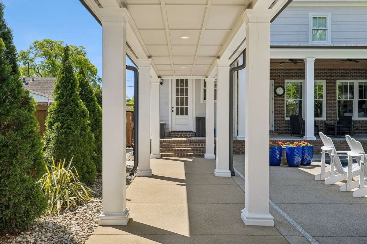 The mudroom entrance is pictured straight ahead. There is a 1/2 bath right at the entrance for pool convenience.