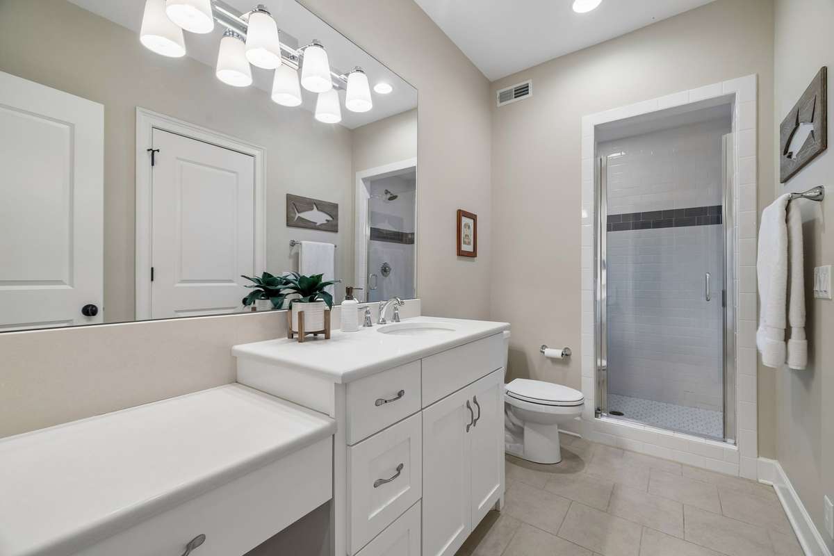 The bathroom is large and offers plenty of storage.
