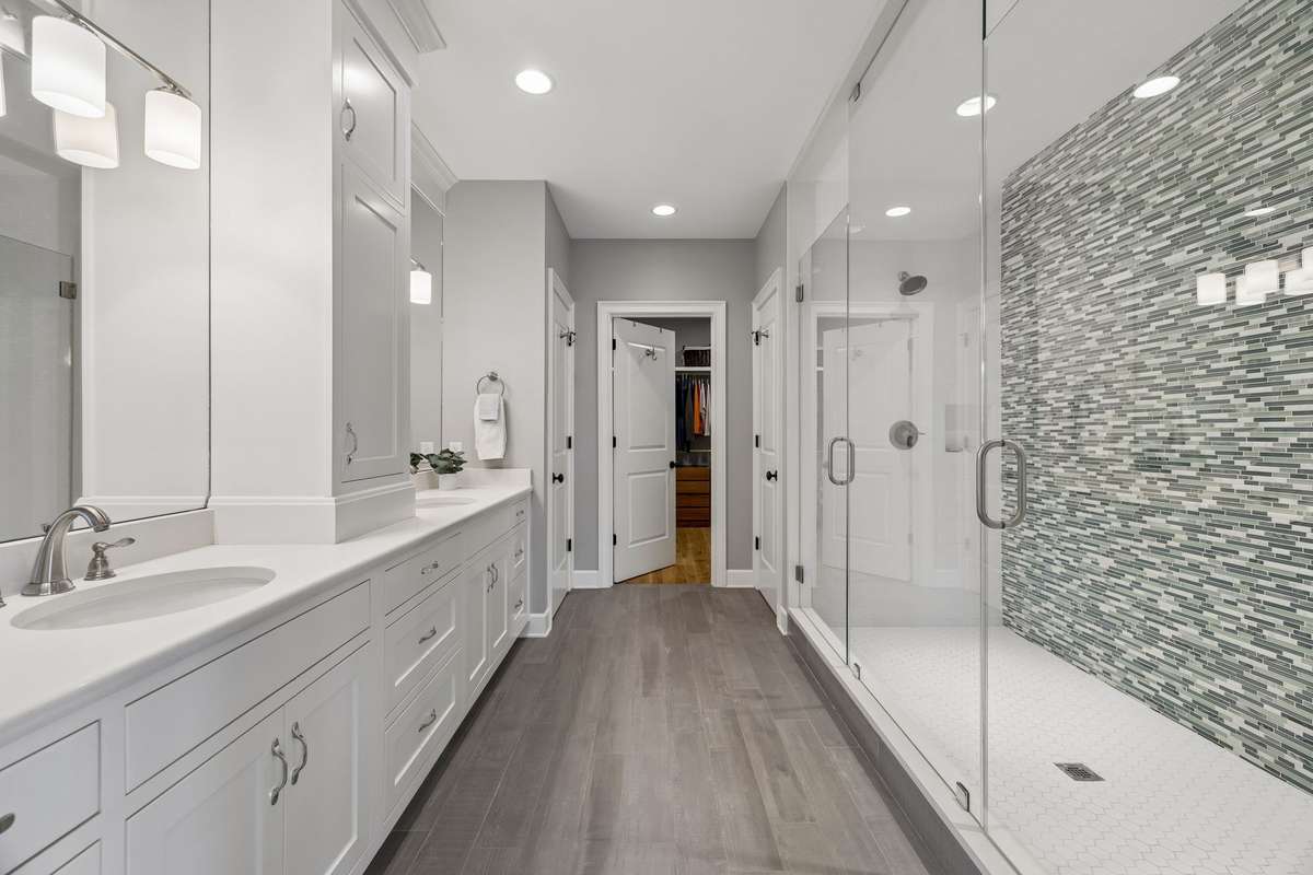 The primary bathroom is well appointed with equal space for 2 + a huge closet to accommodate your every need.
