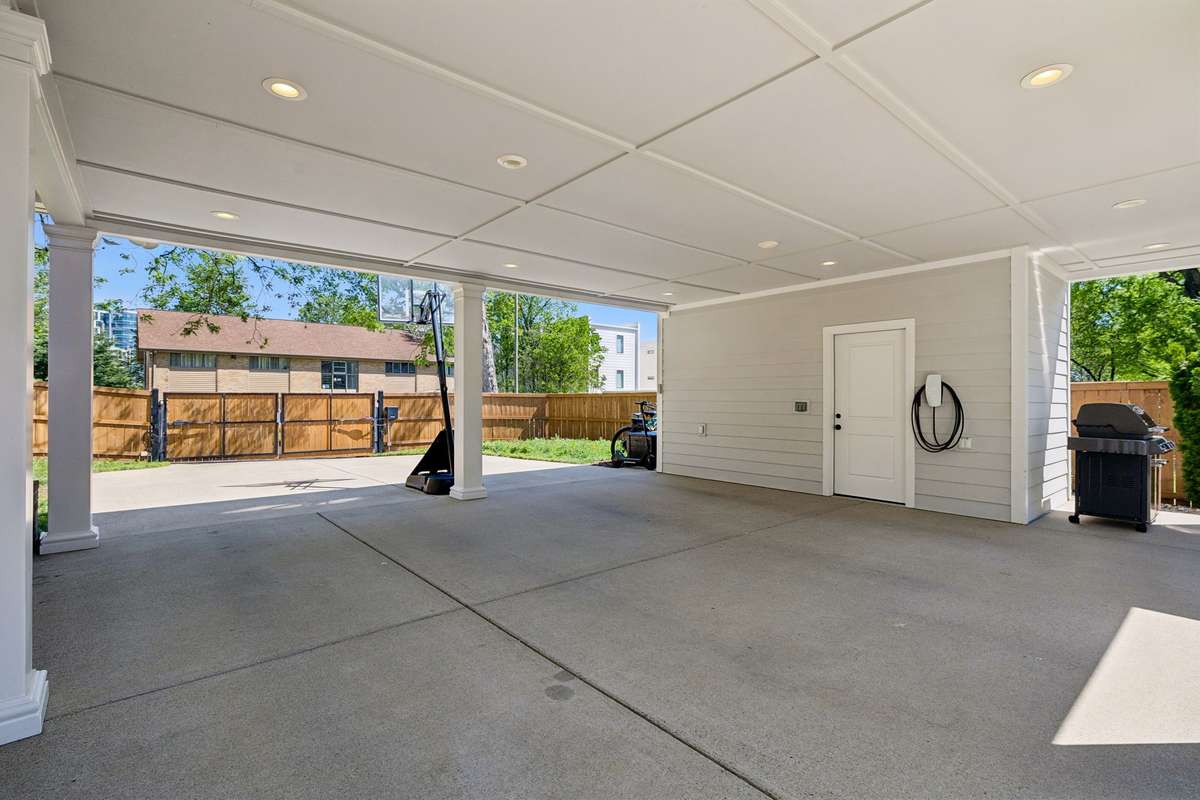 Plenty of space remains behind the architectural pavilion. There is a large storage closet and the electric car charger remains.