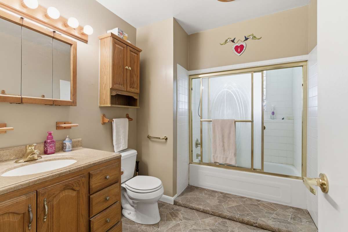 Full bath updated with tile tub/shower combo.