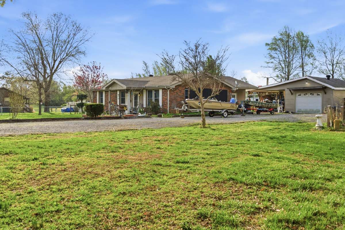 This home features a mix of beautiful flowers that will bloom all spring, summer and fall. There is also a large area previously used as a vegetable garden.