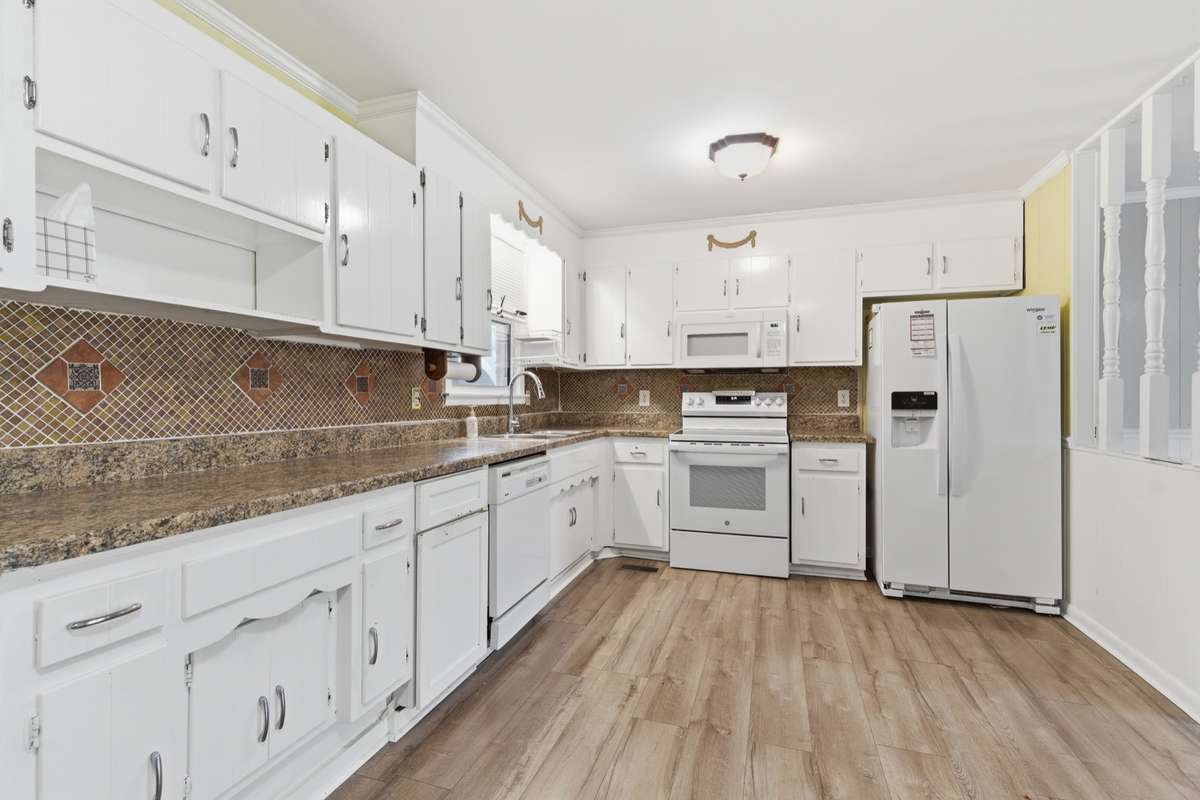 The kitchen features a ton of cabinet and counter space.