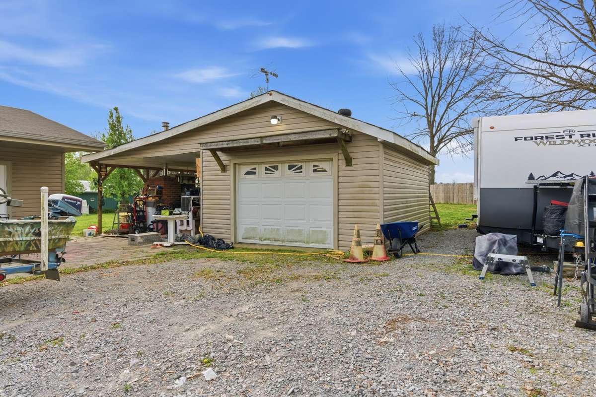 1 car garage with attached patio area. Patio features a built in grilling station - perfect for entertaining.