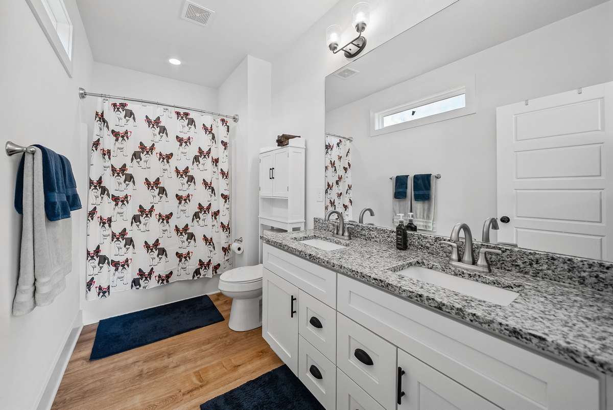 Primary suite bathroom with granite on the double vanity