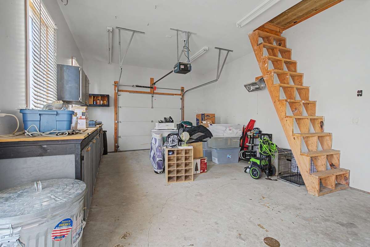 Dedicated workshop, steps lead to floored attic.