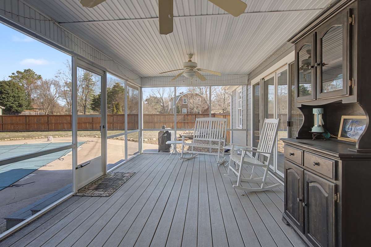 Screened-in porch with plenty of space.