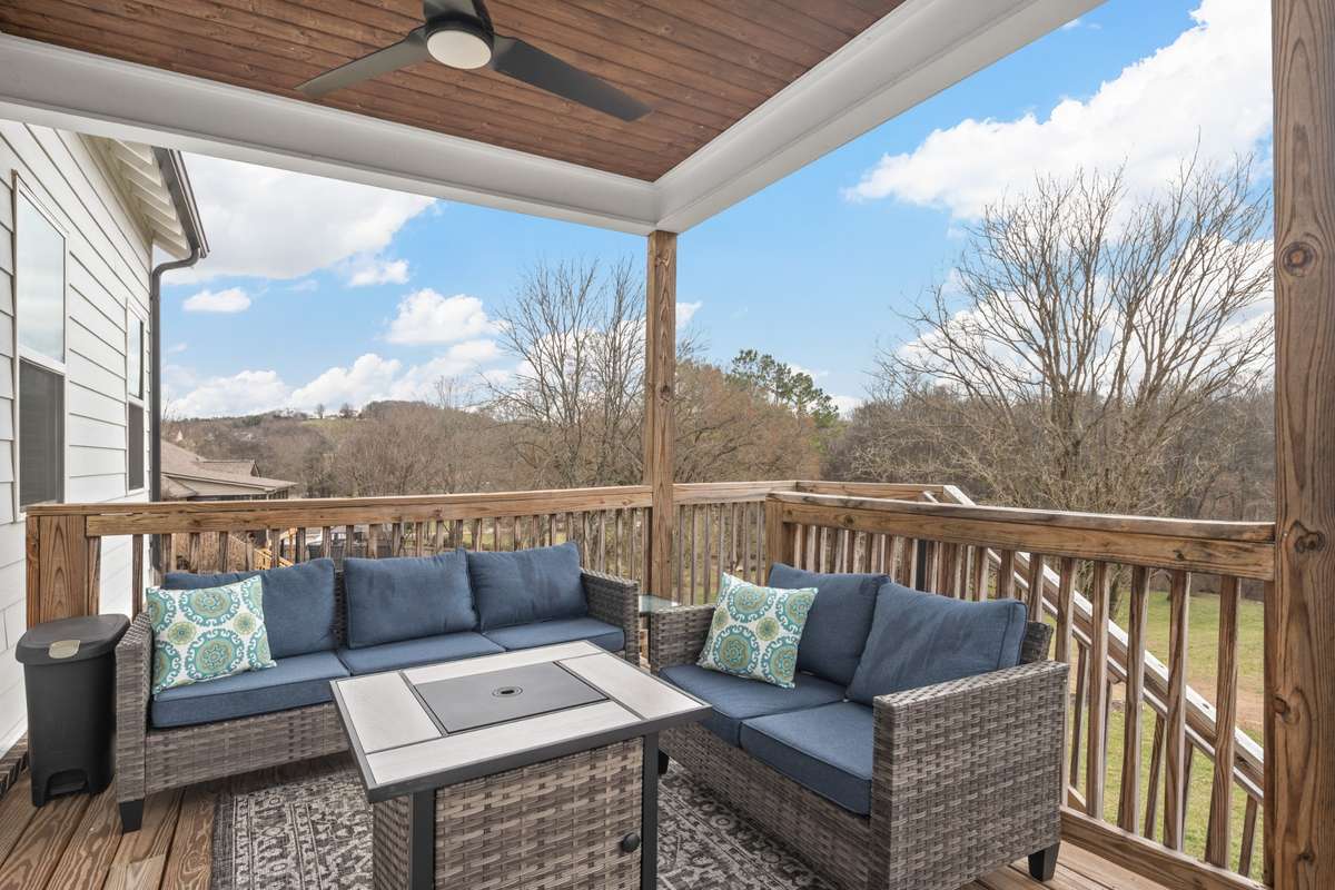 Two covered outdoor areas! This is the back deck and it's perfect for relaxing in the morning or afternoon and watching/ listening to the wild life on your beautiful 2.24 acres!