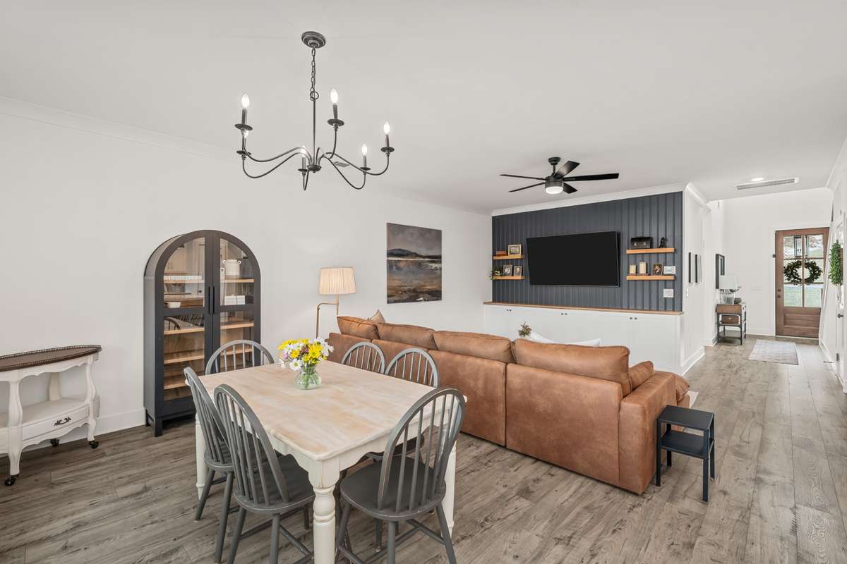 An additional view of the dining and living rooms. You will love the upgrades lighting and tall ceilings throughout.