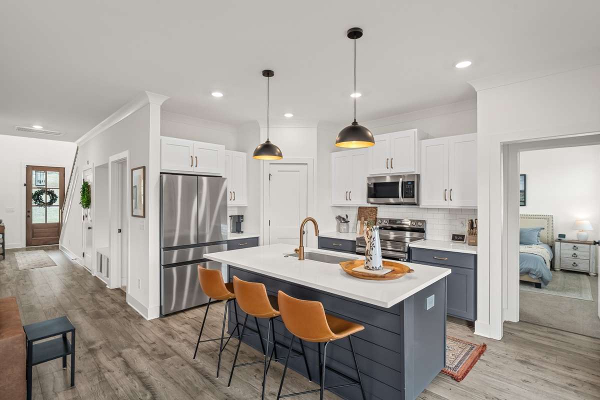 Love, Love, Love this kitchen! The navy cabinets and beautiful countertops really make a statement.