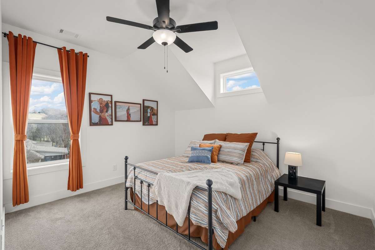The secondary bedroom upstairs has great space and natural light.