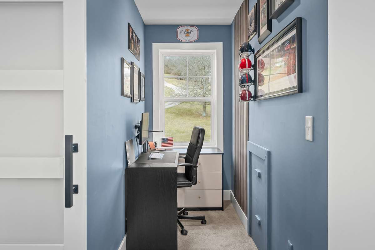 A very nicely renovated area that is currently being used as a work-from-home space. This area could be used for so many things.