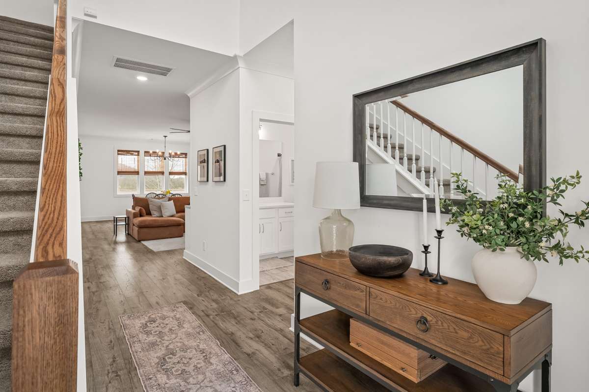 Spacious entry way from the front door.. perfect for an entry way table displayed in the photo  and whatever decor you choose.