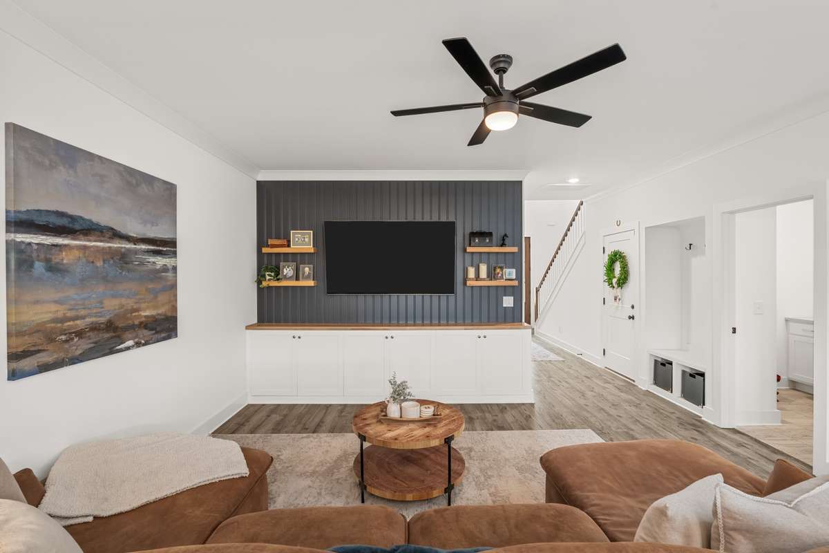 Living space with plenty of room for a sectional or large couch. You will love the built-ins with extra storage space!