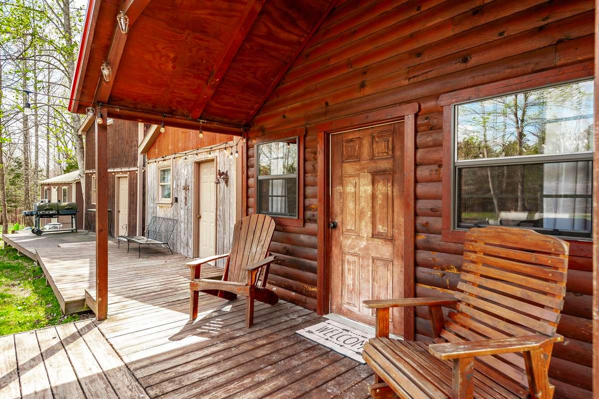 The first cabin beckons with a wonderful front porch