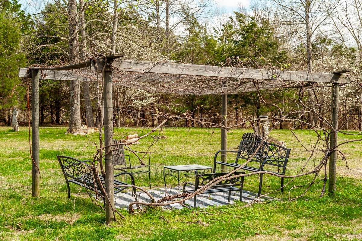 This seating area is gorgeous when the vines are in full bloom