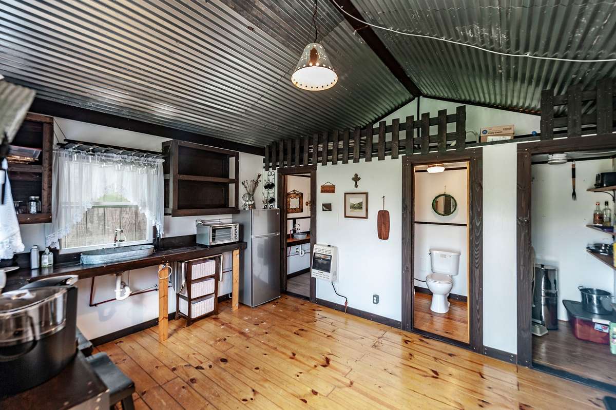 Cabin 2 is the heart of the cabin-trio with a kitchenette with full size refrigerator, bathroom  and eating area