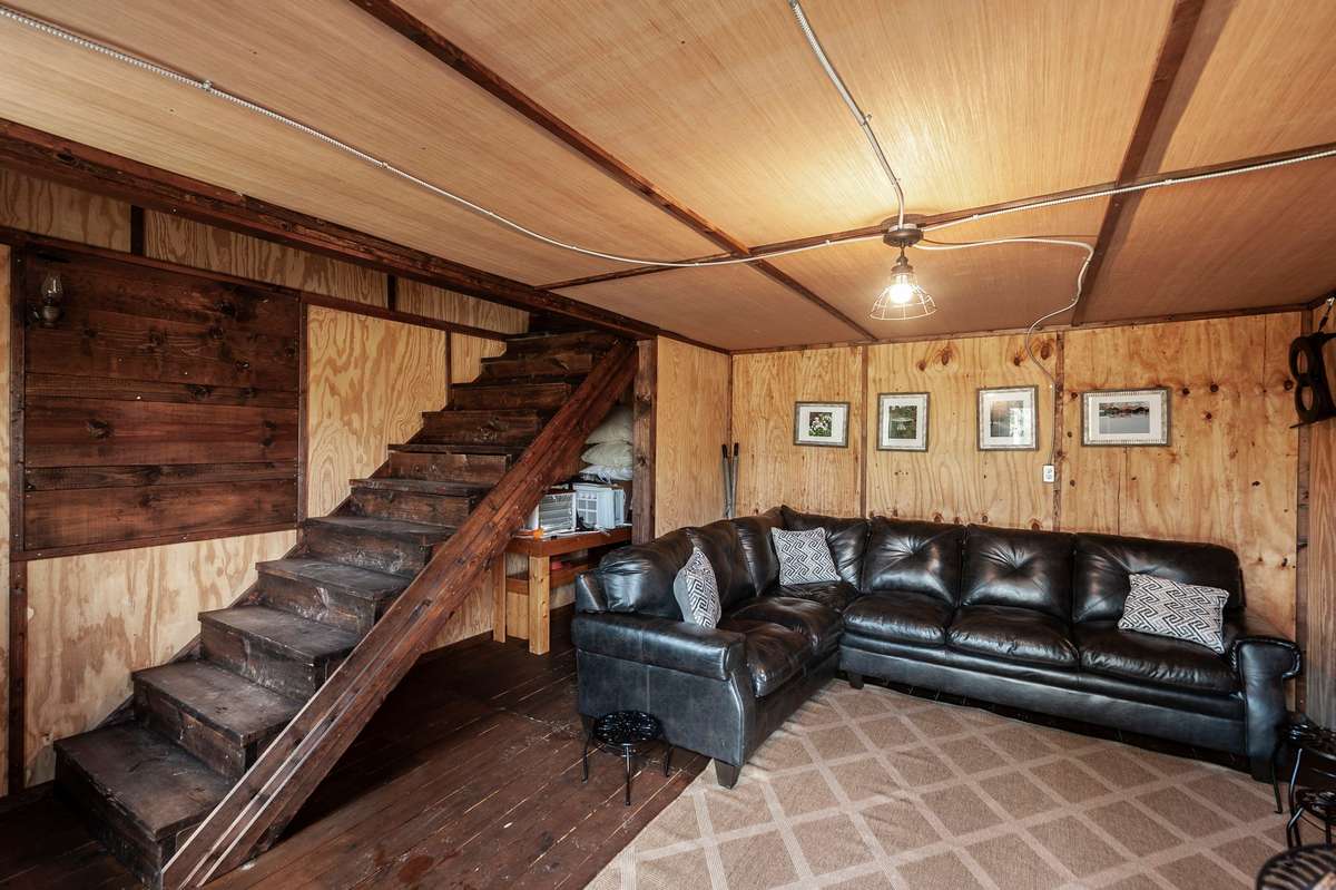A den area with a loft upstairs for extra guests