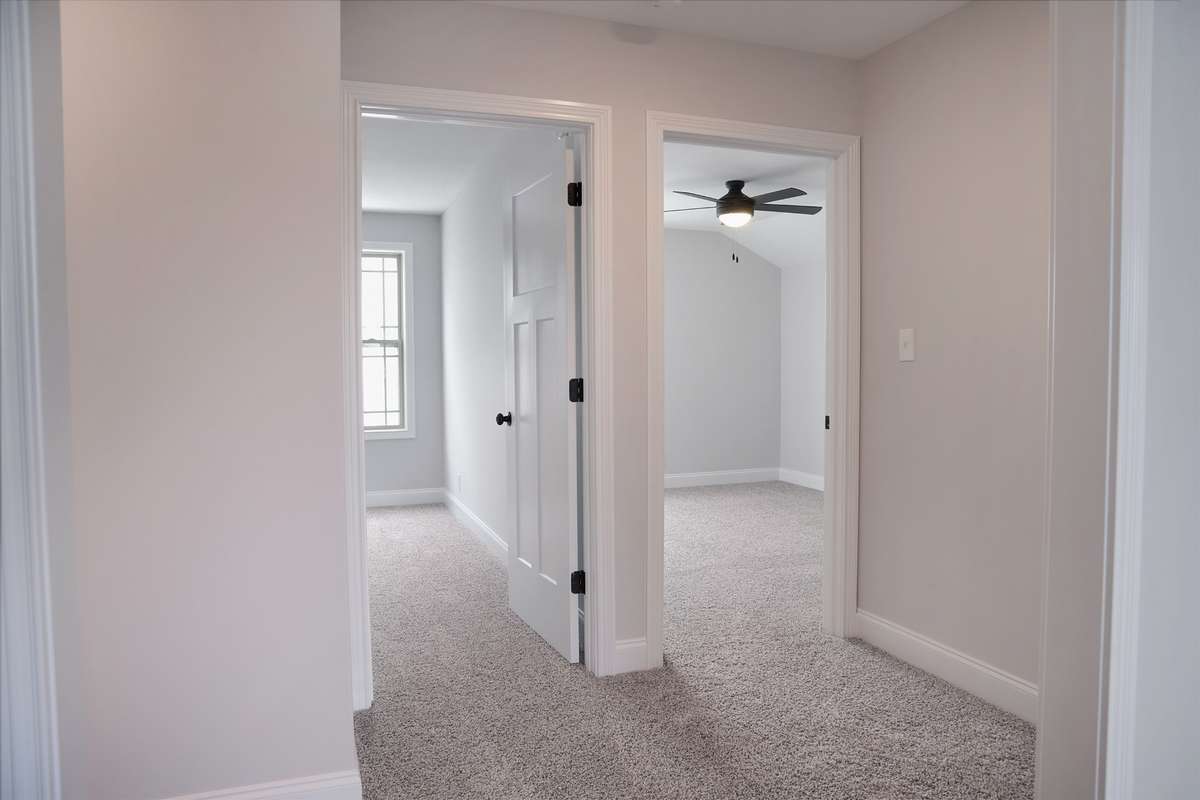 The 2 bedrooms upstairs. All bedrooms have ceiling fans.