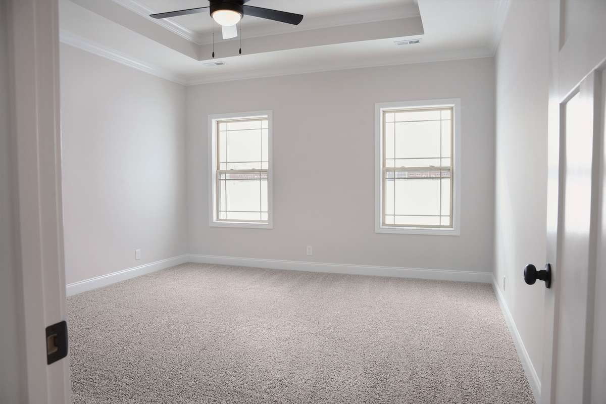 The Master is in the back of the home and the quest bedroom is in the front. Perfect plan.
