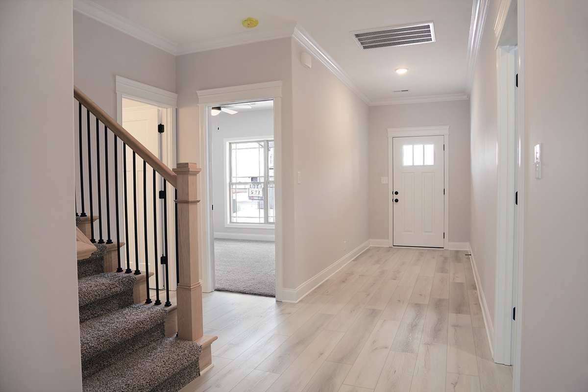 Over view of the foyer, guest bedroom, guest bathroom and laundry room.