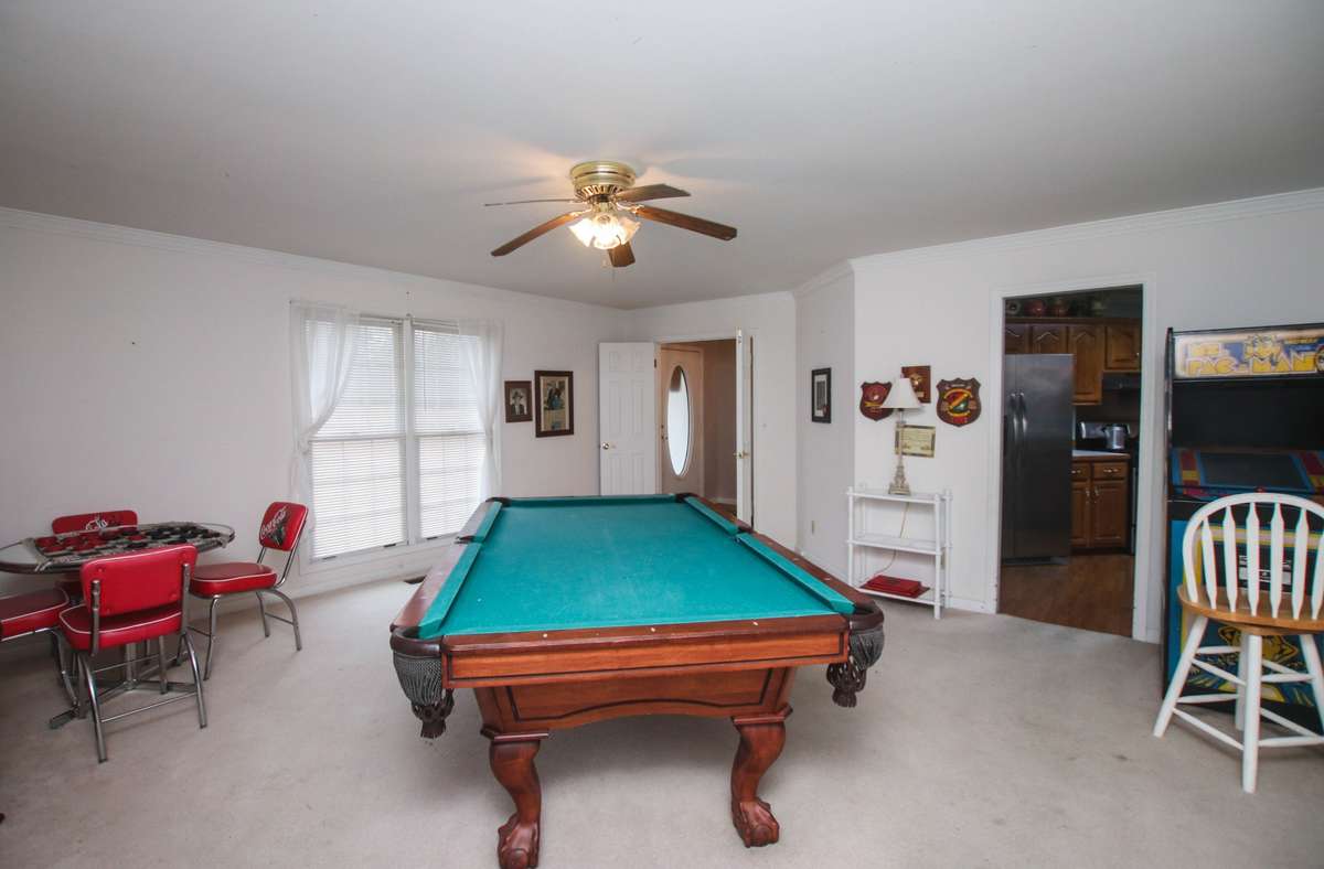 At the end of the pool table is the front door. It also has wooden doors that close if you want more quiet in your home