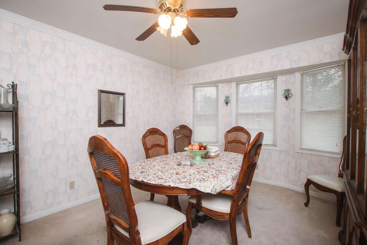The formal dining room has lots of light coming streaming into the windows! It also has double wooden doors to the entrance