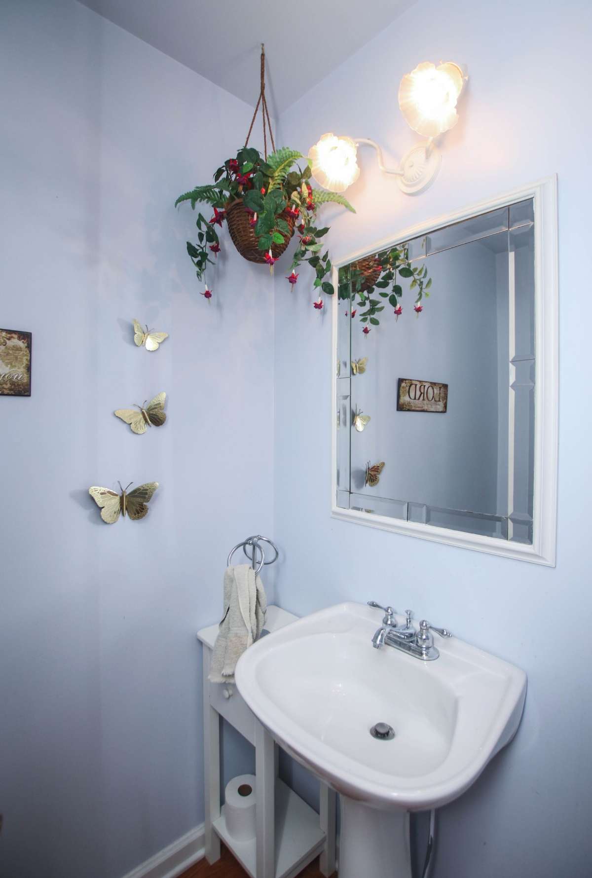 This half bath is off of the kitchen and next to the laundry room