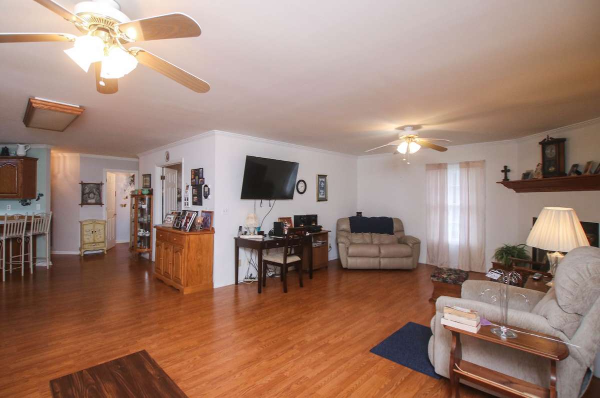 The large family room has everything you need! Plenty of seating area, easy access to the kitchen and and a lovely gas fireplace