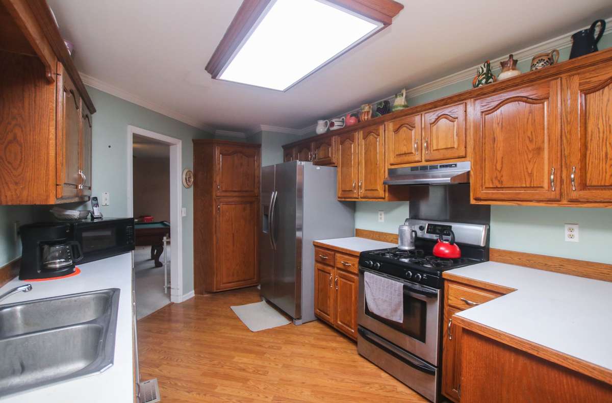 The kitchen access the bonus room. Lots of light and counterspace