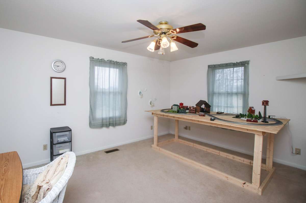 Secondary room behind the living room areas, It also features a walk in closet