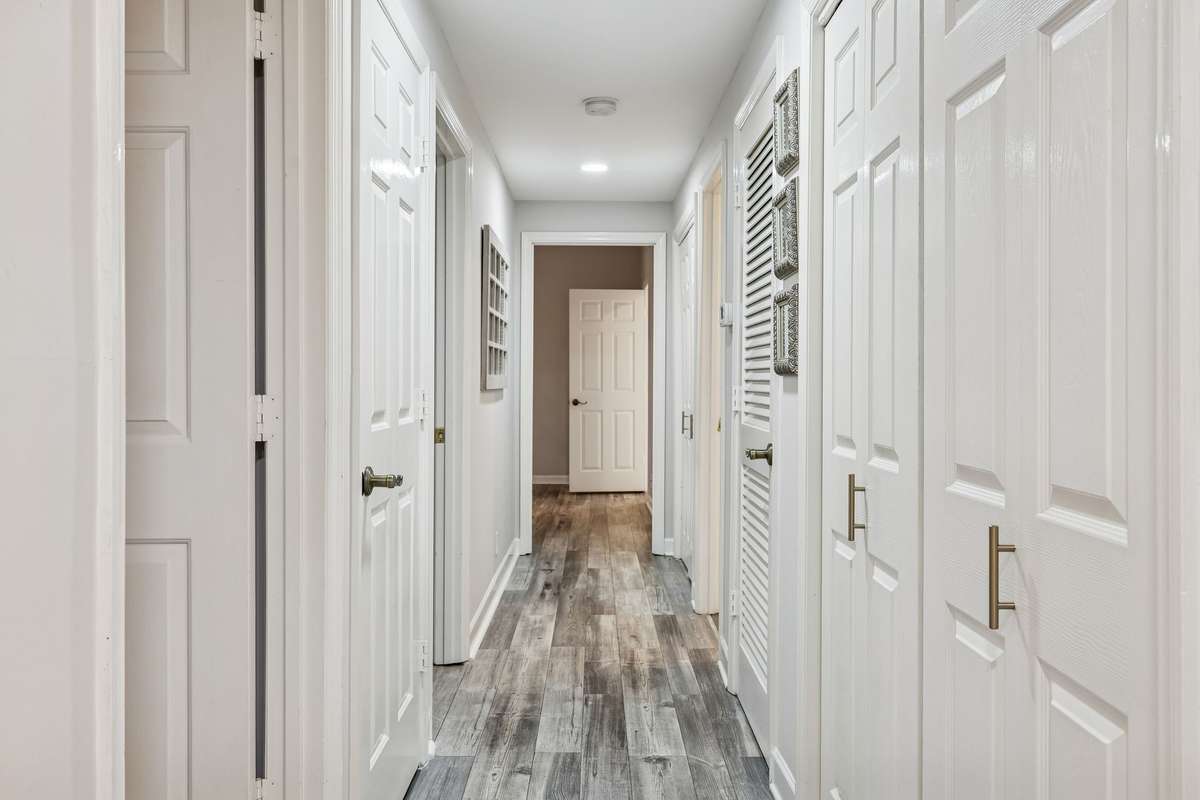 Hallway to Bedrooms with Laundry Area and Pantry.
