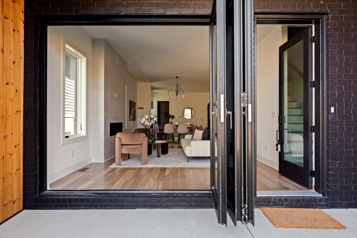 High-end bifold patio doors characterized by ultra-slim frames, superior thermal insulation, and seamless indoor-outdoor transitions
