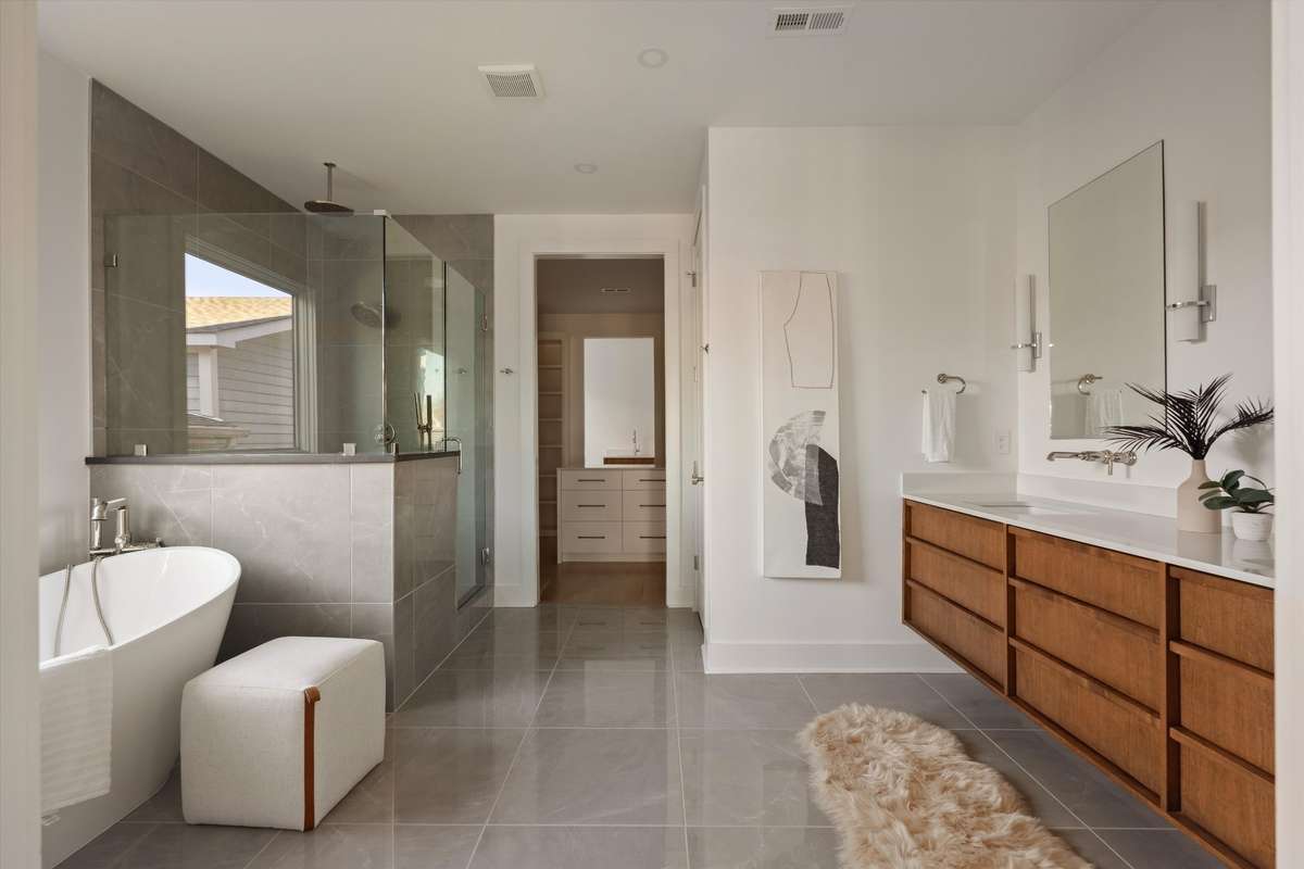 Spa-inspired primary bathroom featuring radiant heated floors for ultimate comfort and indulgence
