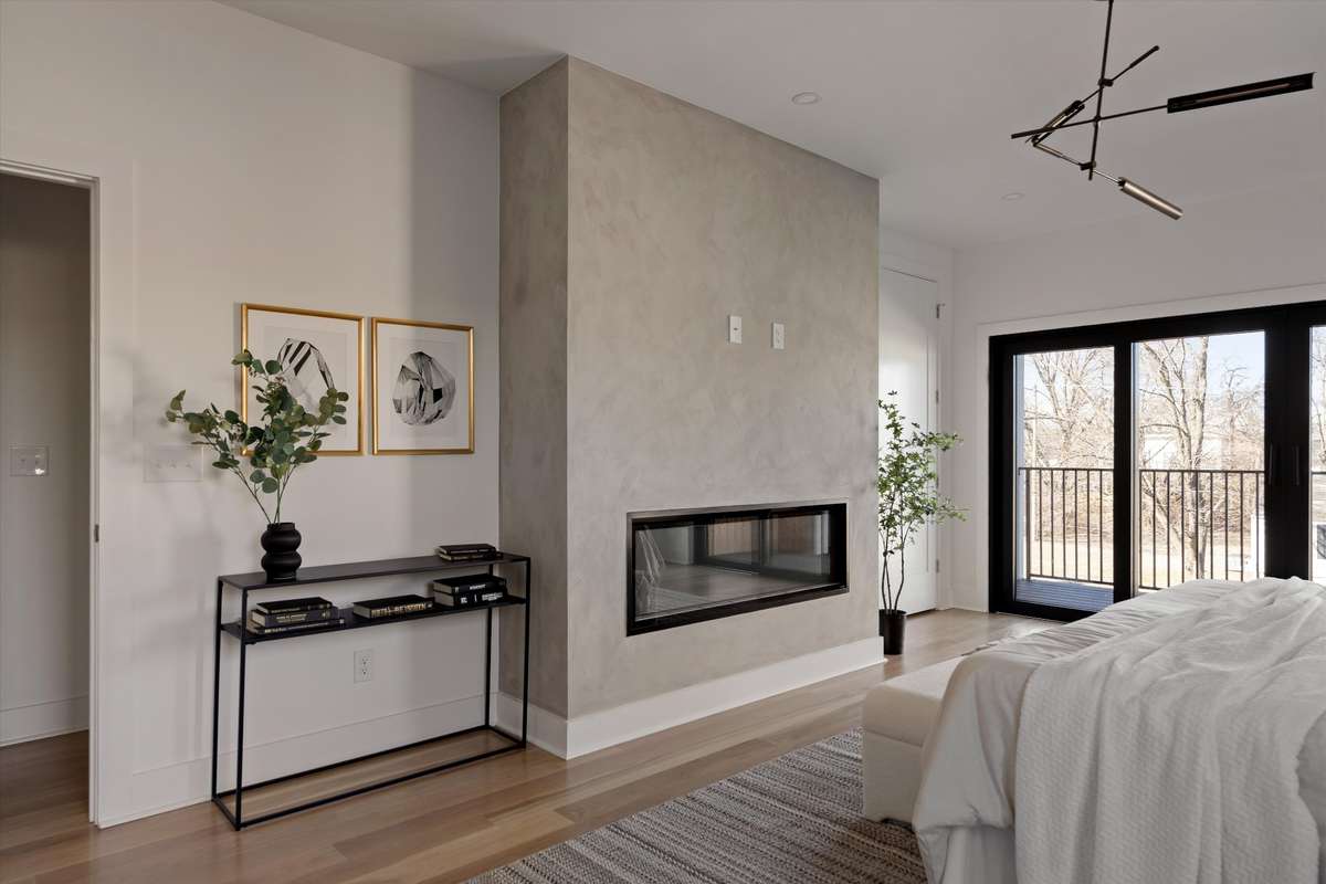 Limewashed fire place in primary bedroom