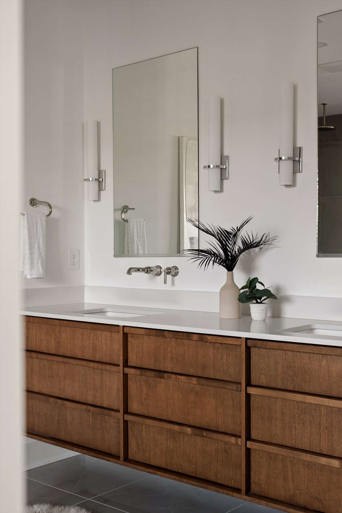 Walnut cabinetry in primary spa