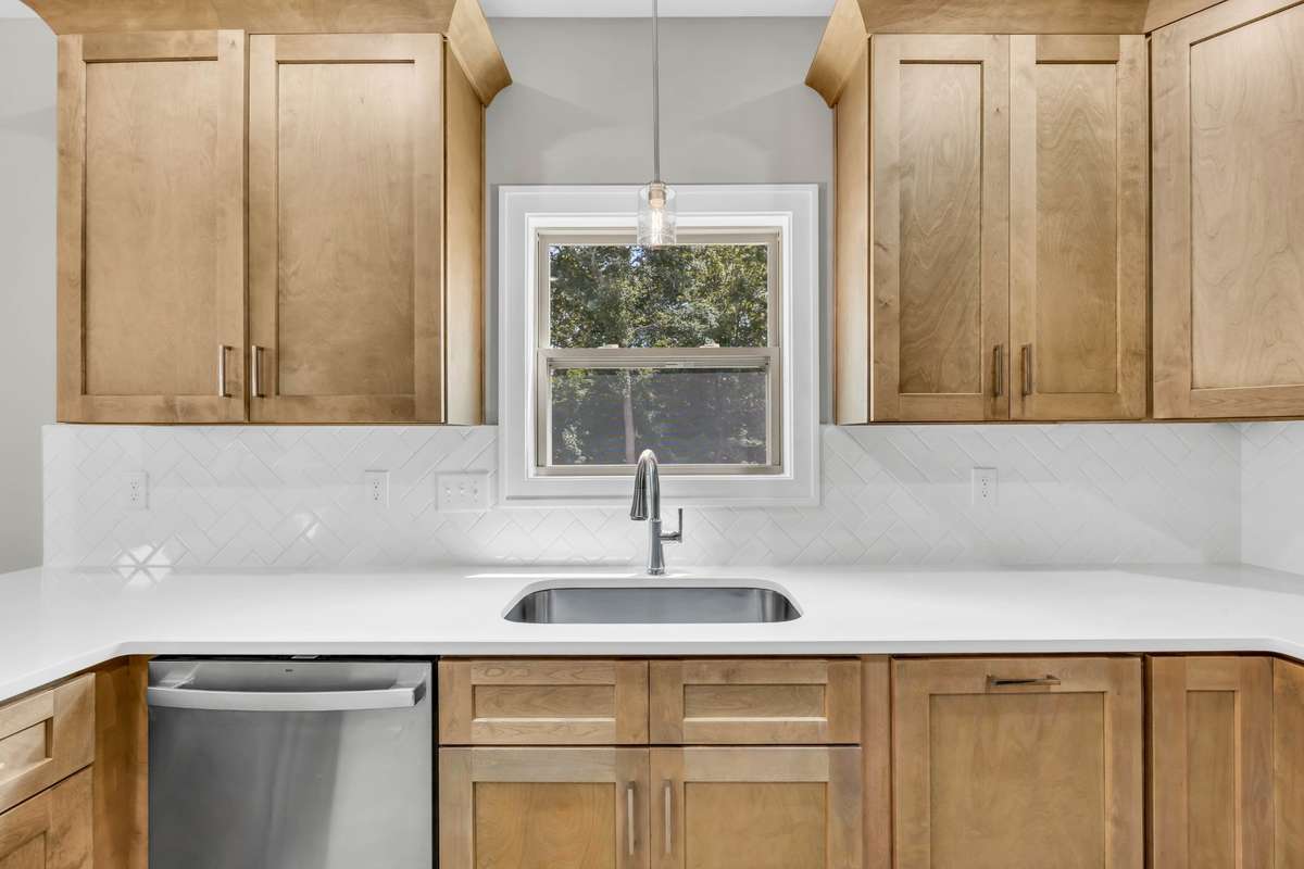 Beautiful natural cabinets and stainless steal appliances complete this gorgeous kitchen