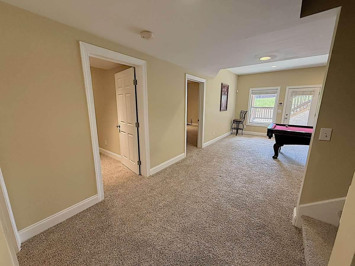 From Stairs landing, room 1 on left and Room 2/movie room on right