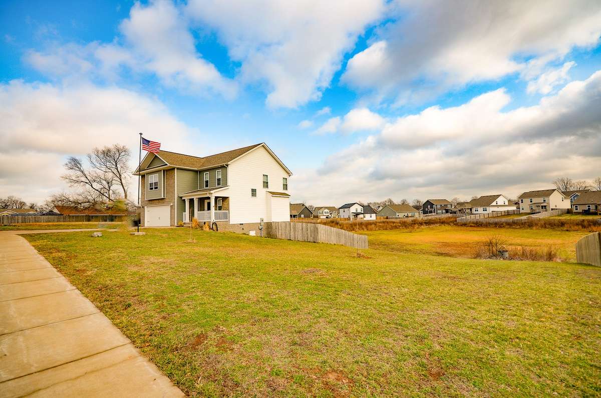 This 1.3-acre lot extends well beyond the fenced area in all directions.
